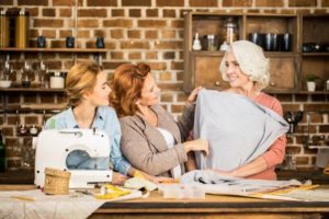 women looking at fabrics